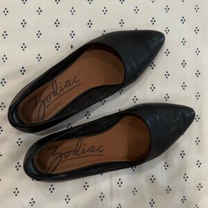 Black leather flats, slightly worn